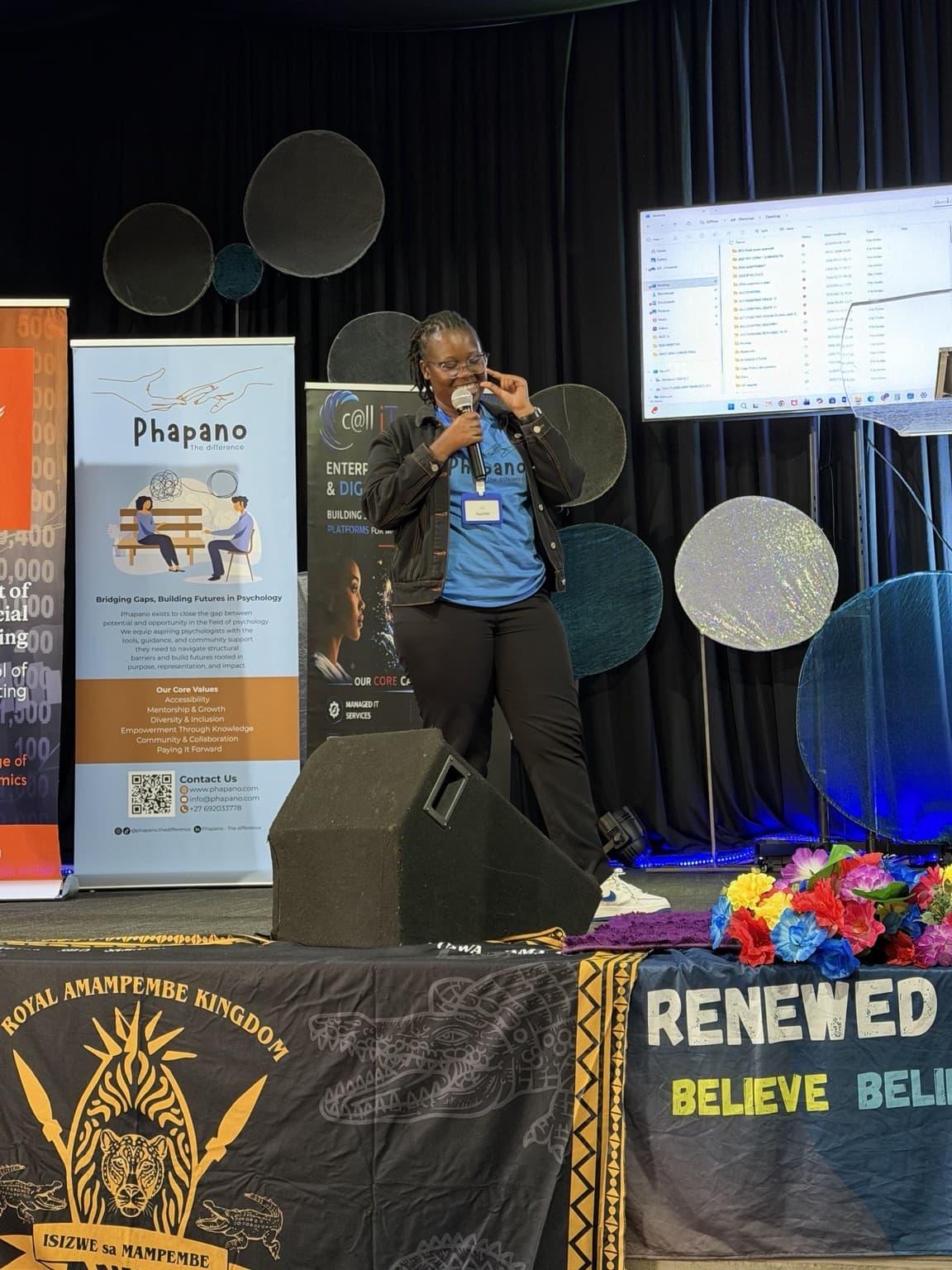 Nqobile Mnisi speaking on stage